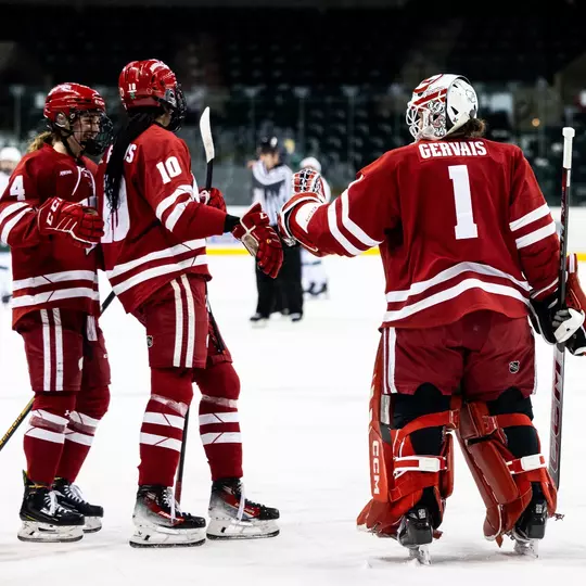 Jane Gervais and Laila Edwards bump fists after a win against Bemidji State on Feb. 9, 2024