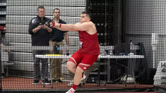 Jason Swarens competes in the weight throw at the Badger Windy City Invitational on Feb. 9