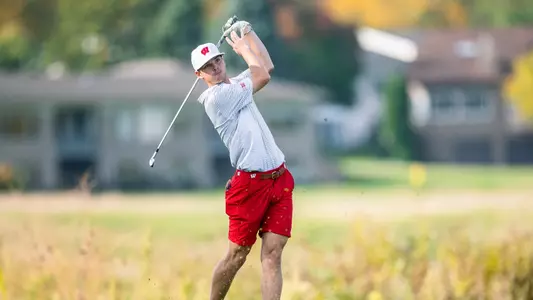 Ryan Smith finishes a swing at the 2023 Badger Individual tournament at TPC Wisconsin