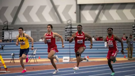 Sam Amusan and Giovanni Wearing run side-by-side in the men's 60 meters at the Badger Windy City Invitational