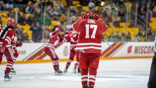 Britta Curl goes to celebrate with teammates after winning the 2023 NCAA semifinal game