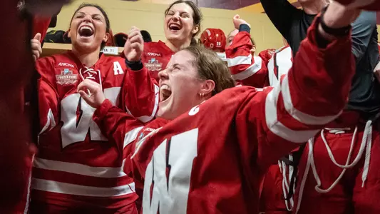 Britta Curl celebrates moving on to the 2023 NCAA Championship game with teammates