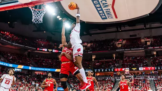 AJ Storr dunks during a game against Maryland