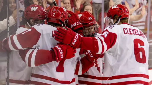 The Wisconsin men's hockey team celebrates scoring a goal against Penn State.