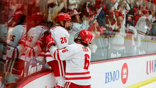 Lacey Eden and Casey O'Brien celebrate a goal against Ohio State on Feb. 24, 2024 at LaBahn Arena