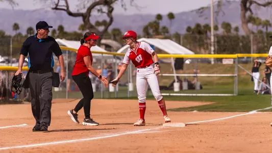 Coach Healey high fives player