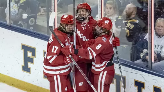 Owen Mehlenbacher, Carson Bantle and William Whitelaw celebrate scoring a goal at Notre Dame.