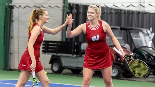 Maria Sholokhova and Alina Mukhortova celebrate after a point