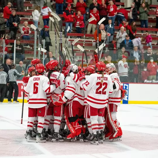Wisconsin women's hockey celebrates a win at center ice
