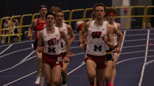 Adam Spencer and Bob Liking run side-by-side in the mile at the Michigan Invitational (Jan. 27)