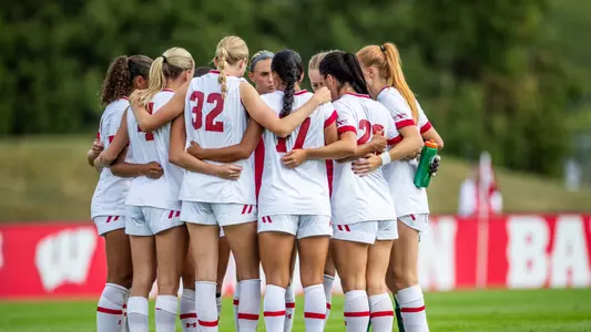 Wisconsin women's soccer in a huddle