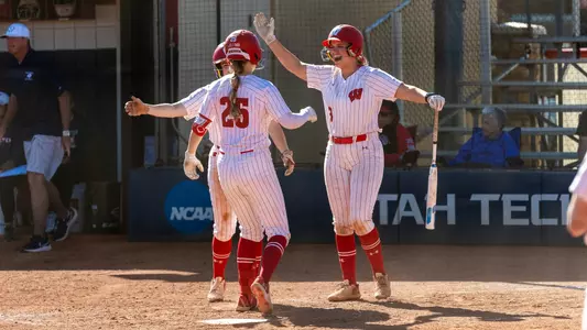 Badgers celebrate Emmy Wells home run against Utah Tech