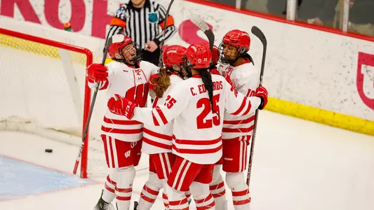 Wisconsin women's hockey celebrates a goal against St. Thomas on March 2, 2024