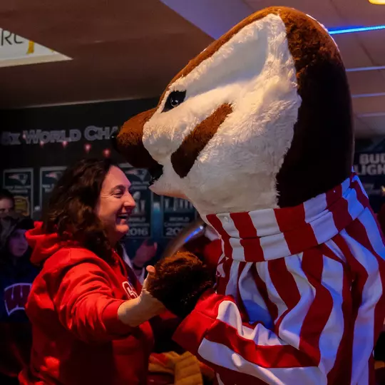 Bucky and a fan at the 2024 Frozen Four fan event at Libby's