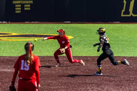Ellie Hubbard flips ball to second for an out at Iowa