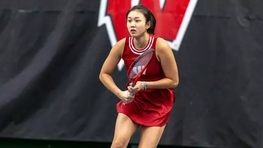 Xinyu Cai looks at shot