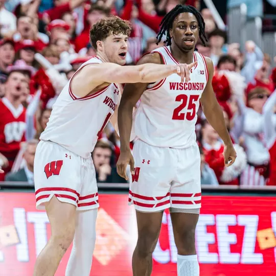 Max Klesmit (11) and John Blackwell (25) against Illinois