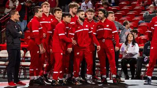 Eric Barnett and the Badgers get ready to run out for lineup announcements prior to Wisconsin's dual match against Illinois on Sunday, Feb. 11, 2024 at the UW Field House in Madison, Wisconsin.