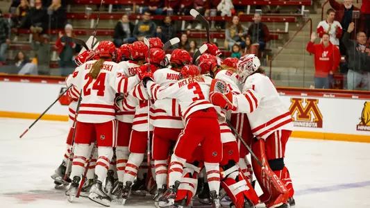 Wisconsin women's hockey celebrates a 4-3 OT win over Minnesota on March 8, 2024