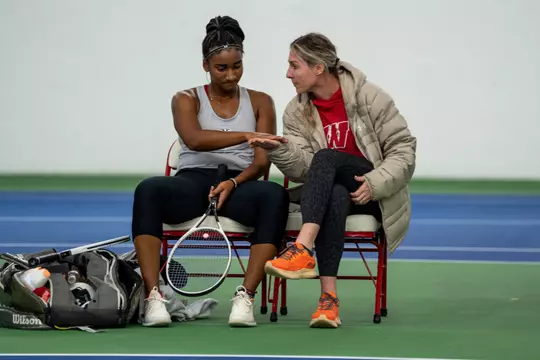 Ariel Johnson sits and talks with coach Kelcy McKenna