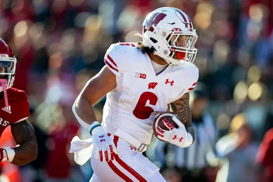Wisconsin Badgers running back Chez Mellusi (6) scores a touchdown during an NCAA college football game against the Rutgers Scarlet Knights, Saturday, Nov. 6, 2021, in Piscataway, N.J. The Badgers won 52-3. (Photo by David Stluka/Wisconsin Athletic Communications)