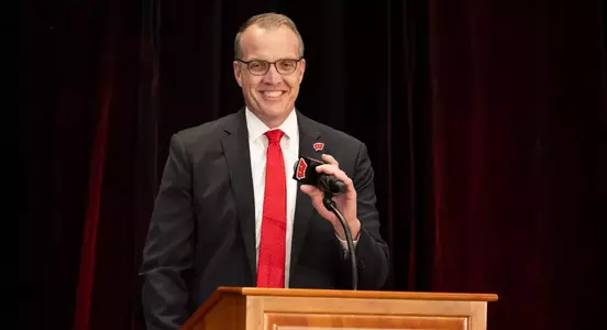 Chris McIntosh speaks from podium