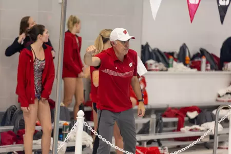 Head coach Yuri cheers during swim meet