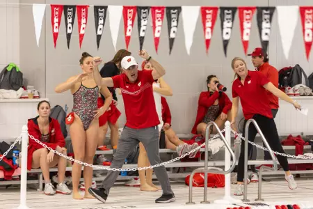 head coach Yuri cheers during meet