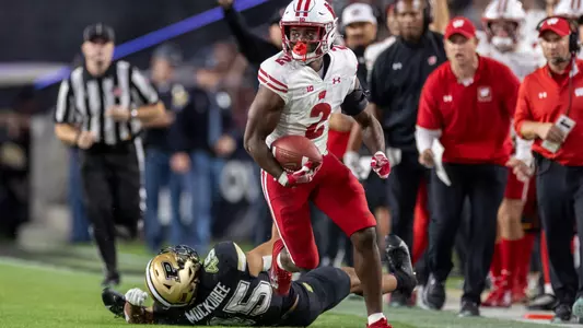 Wisconsin Badgers defensive back Ricardo Hallman (2) returns an interception during an NCAA college football game against the Purdue Boilermakers, Sept. 22, 2023, in West Lafayette, Indiana. The Badgers won 38-17. (Photo by David Stluka/Wisconsin Athletic Communications)