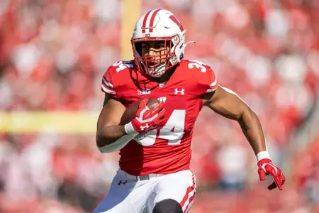 Wisconsin Badgers running back Jackson Acker (34) carries the ball during a Big Ten Conference NCAA college football game against the Rutgers Scarlet Knights, Saturday, Oct. 7, 2023, in Madison, Wis. The Badgers won 24-13. (Photo by David Stluka/Wisconsin Athletic Communications)