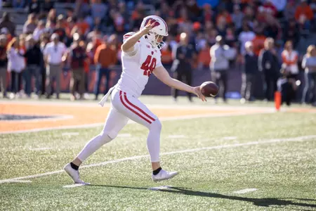 Wisconsin Badgers punter Atticus Bertrams (49) punts the ball during a Big Ten Conference NCAA college football game against the Illinois Fighting Illini, Saturday, Oct. 21, 2023, in Champaign, Ill. The Badgers won 25-21. (Photo by David Stluka/Wisconsin Athletic Communications)