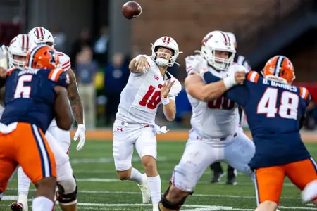 Wisconsin Badgers quarterback Braedyn Locke (18) throws the ball during a Big Ten Conference NCAA college football game against the Illinois Fighting Illini, Saturday, Oct. 21, 2023, in Champaign, Ill. The Badgers won 25-21. (Photo by David Stluka/Wisconsin Athletic Communications)