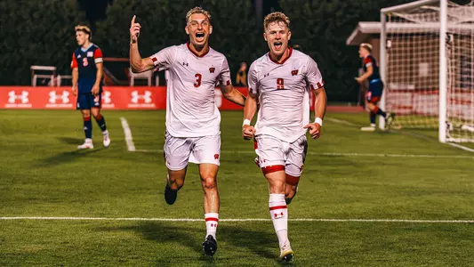 Trip Fleming (8) celebrates one of his three goals with Noah Glorioso against UIC