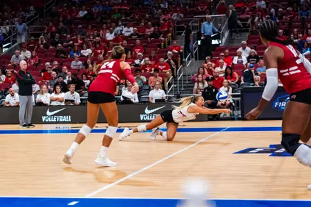 Saige Damrow dives for the ball