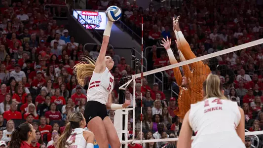 Sarah Franklin hits the ball in match vs Texas