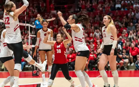 Badgers celebrate winning point vs Aggies