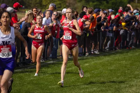 Shea Ruhly and Lindsay Cunningham cross the finish line at the 2024 Nuttycombe Wisconsin Invitational.