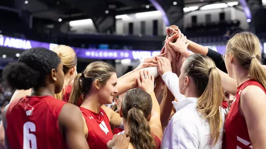 Team huddle before match vs Northwestern