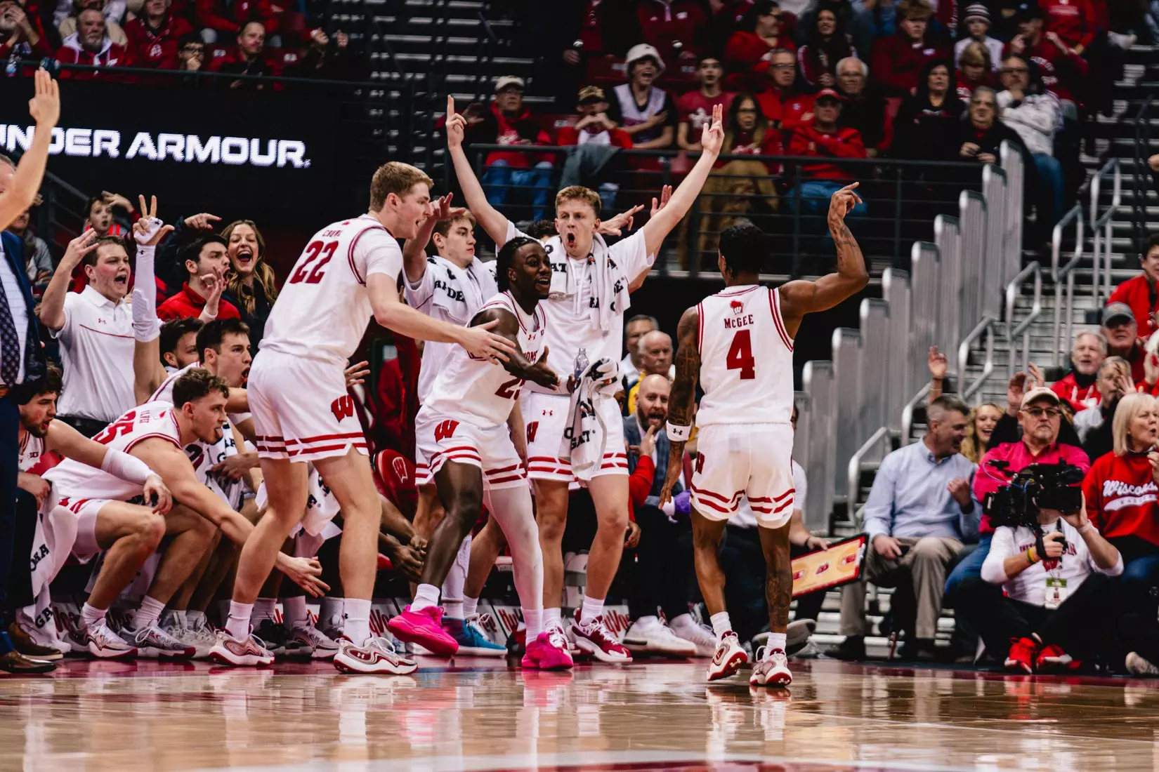 Kamari McGee celebrates a 3-pointer with the bench
