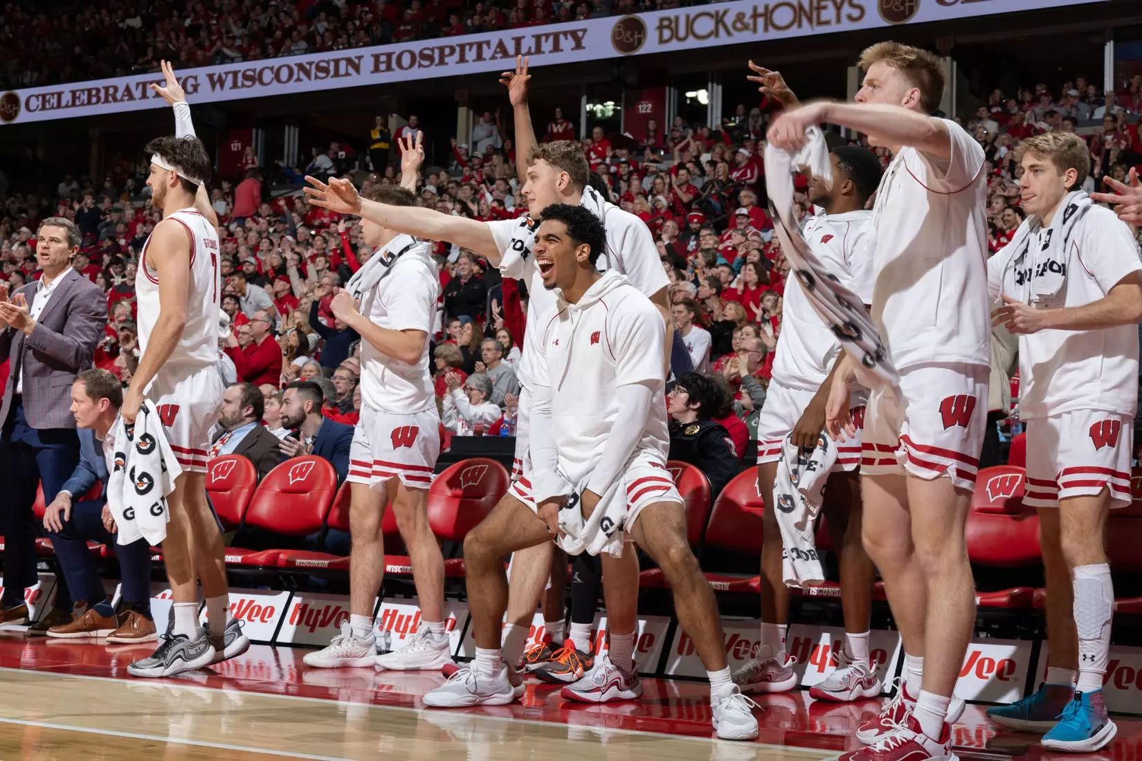 The bench celebrates a big play from the Badgers