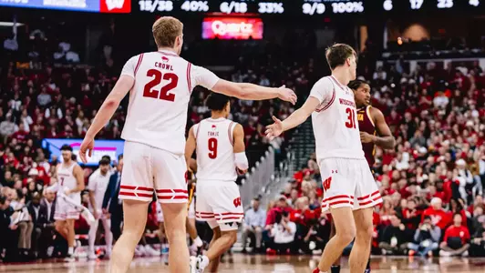 Steven Crowl and Nolan Winter high five