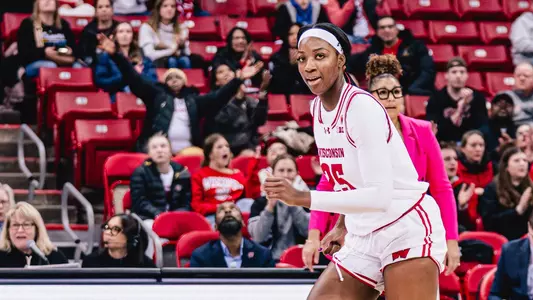 Serah Williams running down the court and looking at camera