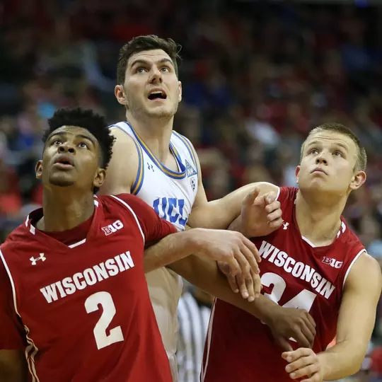 KANSAS CITY, MO - NOVEMBER 21: Wisconsin Badgers forward Aleem Ford (2) and guard Brad Davison (34) block out UCLA Bruins forward Gyorgy Goloman (14) in the second half of the consolation game of the CBE Hall of Fame Classic between the Wisconsin Badgers and UCLA Bruins on November 21, 2017 at Sprint Center in Kansas City, MO. UCLA won 72-70. (Photo by Scott Winters/Icon Sportswire)