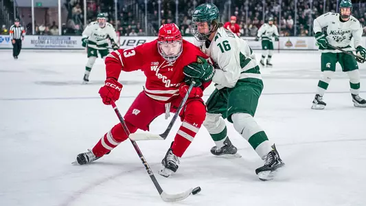 Christian Fitzgerald battles for the puck at MSU
