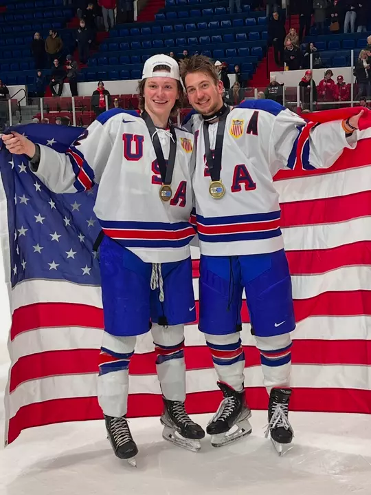 Joe Palodichuk and Quinn Finley after winning a gold medal for Team USA at the 2022 World Junior A Challenge