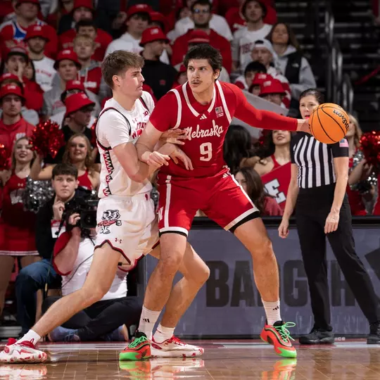 Nolan Winter guards a player against Nebraska