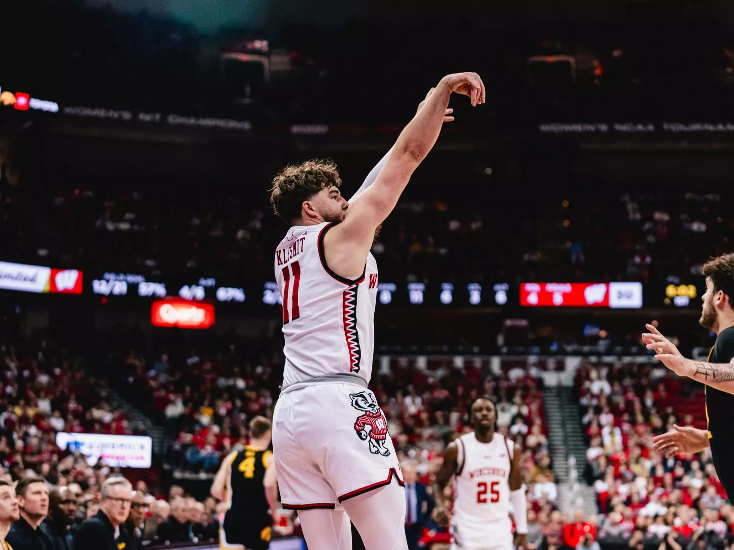 Max Klesmit hits a corner three vs. Iowa