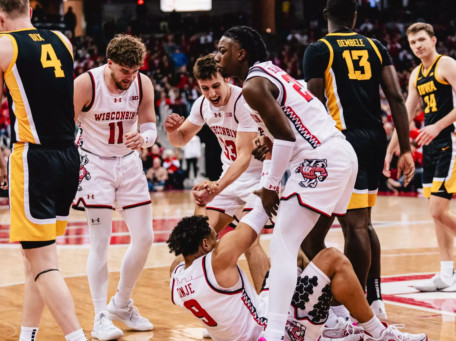 John Blackwell, Jack Janicki, and Max Klesmit help up John Tonje