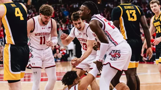 John Tonje is helped off the floor against Iowa