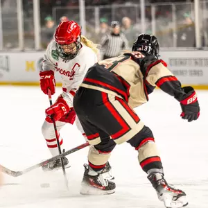 Casey O'Brien stick-handles against OSU